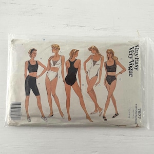 May include: A vintage sewing pattern for swimwear, featuring illustrations of various swimsuit styles. The pattern is in a clear plastic sleeve. The text "Very Easy Very Vogue" is visible, along with the pattern number 7877.