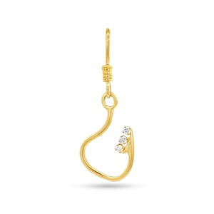 May include: A gold-colored earring in the shape of a fish hook. The hook features three small, clear gemstones. The top of the earring has a coiled design, and the hook curves gracefully.