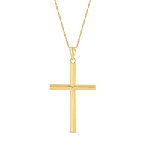 14k solid gold high polish cross pendant on 18" solid gold chain.