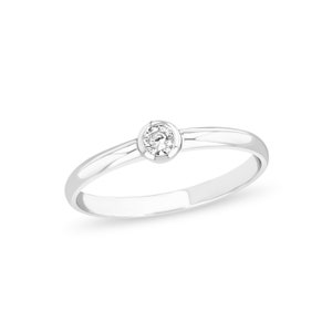14k solid white gold .11ct diamond ring.