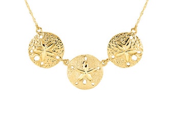 14k solid gold sand dollar necklace on solid gold singapore chain.