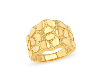May include: A gold-colored ring with a textured surface, featuring a design of irregular, overlapping shapes. The ring has a wide band and a polished finish, reflecting light. The jewelry piece is set against a white background.