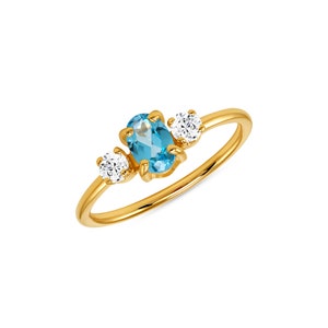 Oro amarillo de 14k diciembre Anillo de piedra de nacimiento de topacio azul.