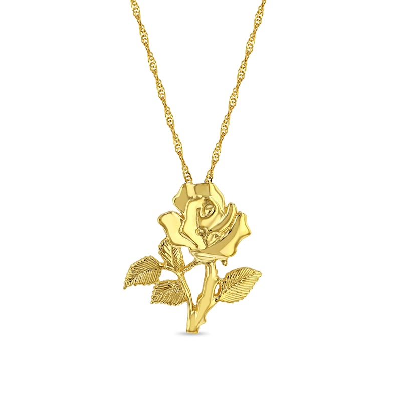 Puede incluir: Un collar con un colgante de rosa de oro con una cadena delicada. La rosa est&aacute; detallada con hojas y un tallo.