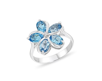 Sterling Silver Genuine Blue Topaz & .02 Diamond ctw. Plumeria Floral Ring.