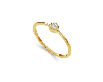 14k solid  gold .06ct diamond ring. stackable ring.