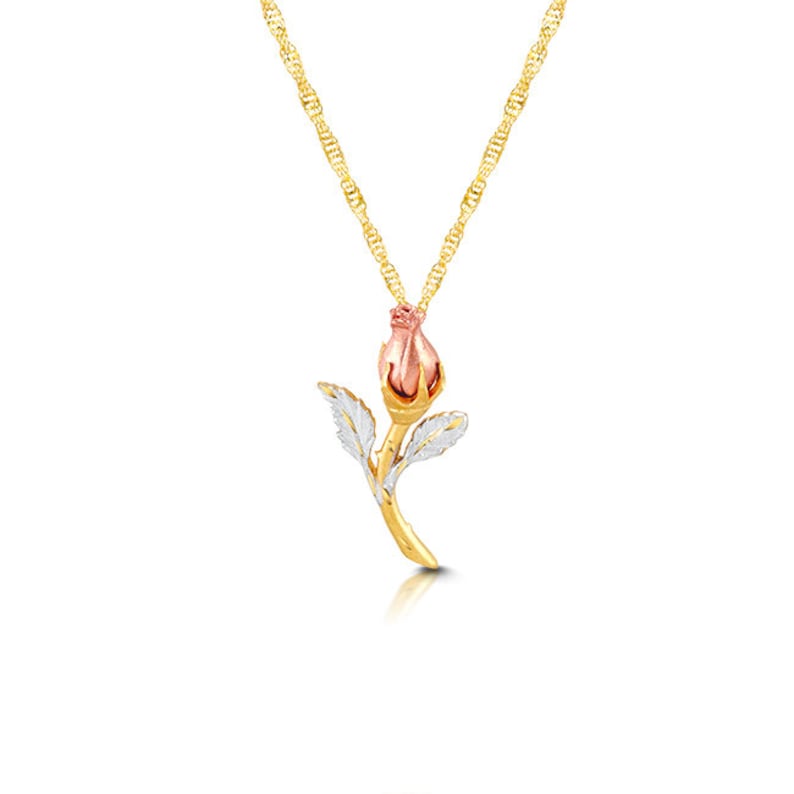 May include: A gold chain necklace with a rose bud pendant. The rose bud is made of gold and has a pink center. The leaves of the rose are silver.
