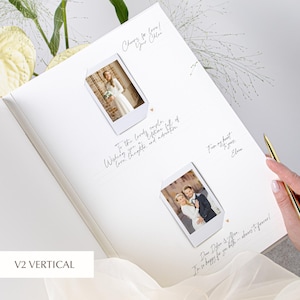 Bride seated and holding an open wedding guest book; two instant photos stacked vertically in white photo corners, with dotted message lines and tiny heart icons; gold pen in hand and a pale green floral arrangement to the side.