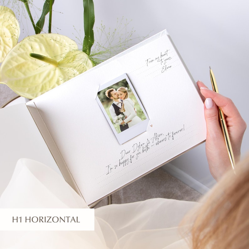 Wedding guestbook page with single instant photo and handwritten congratulations, elegant horizontal layout