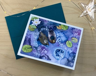 Greeting card, couple of ducks with moon reflection.