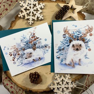 Pack of two greeting cards, hedgehog with fir branches and Christmas decorations. image 5