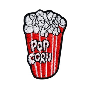 May include: Red and white striped popcorn bucket with the word "POP CORN" embroidered in black.