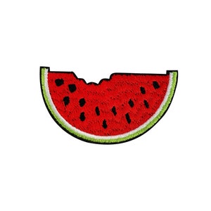 May include: A red watermelon slice with black seeds and a green rind. The watermelon is cut in half and has a bite taken out of it.