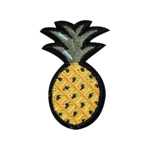 May include: A yellow pineapple with a black outline and brown details. The pineapple has a green leafy top.