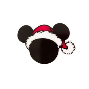 May include: A black and white cartoon image of Mickey Mouse wearing a red and white Santa hat.