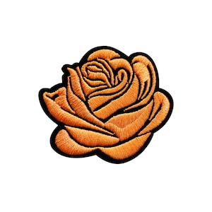 May include: A single orange embroidered rose with a black outline.