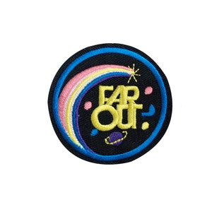 May include: A round, black embroidered patch with a rainbow, stars, and the text "FAR OUT!" in yellow.