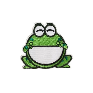 May include: Green embroidered frog patch with closed eyes and a white belly.