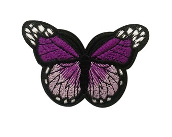 May include: Purple embroidered butterfly patch with black outline and white accents.