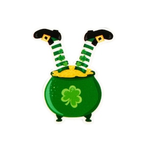 May include: A green pot with gold coins and two green and white striped legs sticking out of the top. The pot has a shamrock on the front.