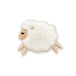 May include: White fluffy sheep applique with brown embroidered legs and a black eye. The sheep is in a running pose.