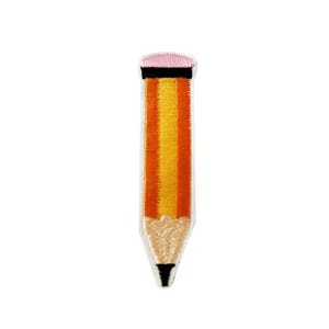 May include: A yellow and orange pencil with a pink eraser. The pencil is embroidered on a white fabric.