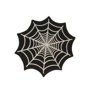 May include: Black embroidered iron-on patch with a white spider web design.