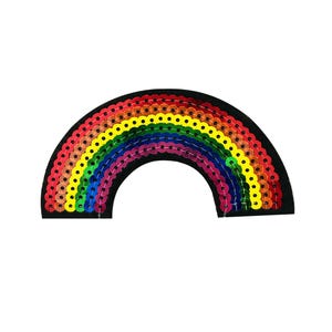 May include: A rainbow-colored sequin patch in the shape of an arc. The patch is made of colorful sequins sewn onto a black fabric base.