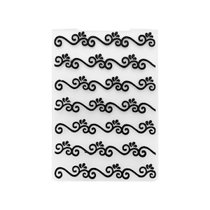 May include: Clear plastic sheet with multiple rows of black decorative border designs. Each design features a wavy line with swirls and small flower-like accents.
