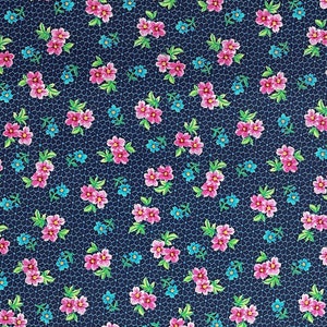 May include: A navy blue fabric with a repeating pattern of pink flowers and blue forget-me-nots.