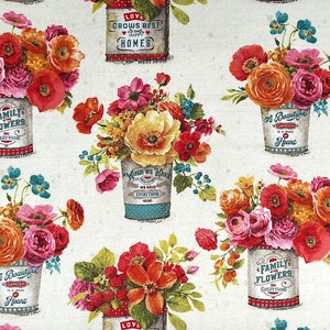 May include: A white fabric with a repeating pattern of colorful flower bouquets in vintage metal cans. The cans have various sayings on them, including "Love Grows Best in Happy Homes", "Family Flowers Are Everything", and "A Beautiful Garden is in the Heart".
