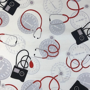 May include: A white fabric with a repeating pattern of red stethoscopes, black blood pressure cuffs, and gray gauges. The gauges have numbers from 0 to 300.