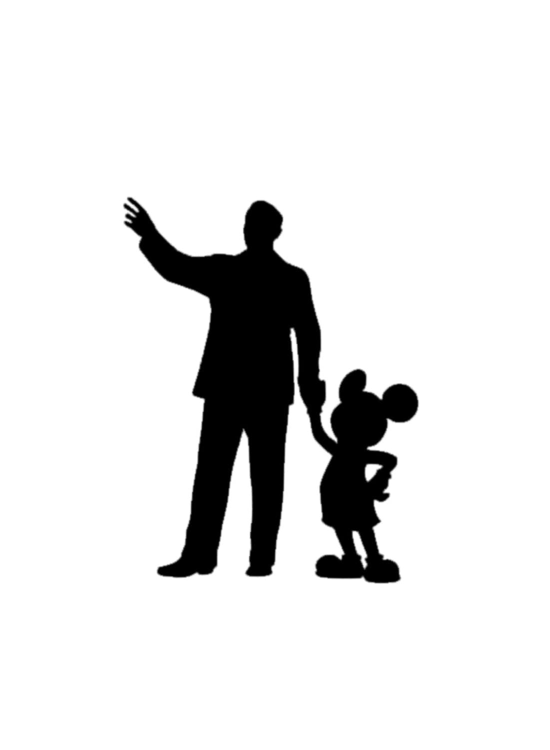 walt disney with mickey mouse statue