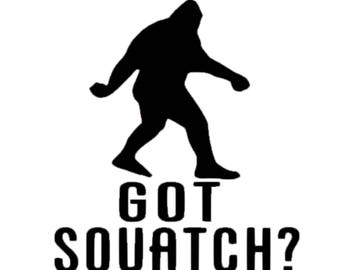 May include: A black silhouette of a Bigfoot creature walking, positioned above the black text that reads GOT SQUATCH? in a bold, sans-serif font. The design is presented against a plain white background, featuring clean lines and high contrast.