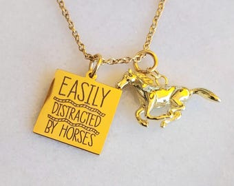 May include: Gold necklace with a square pendant that says "Easily Distracted by Horses" and a small gold horse charm.