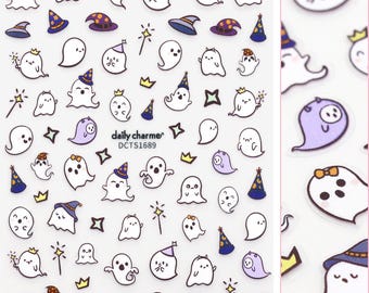 May include: A sheet of white sticker paper with a variety of cute ghost designs. The ghosts are wearing hats, crowns, and bows. The sheet is labeled "daily charmer" and "DCTSI689".