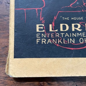 May include: A black and red vintage poster advertising "The House of Entertainment" at Eldredge Theatre in Franklin, Ohio.