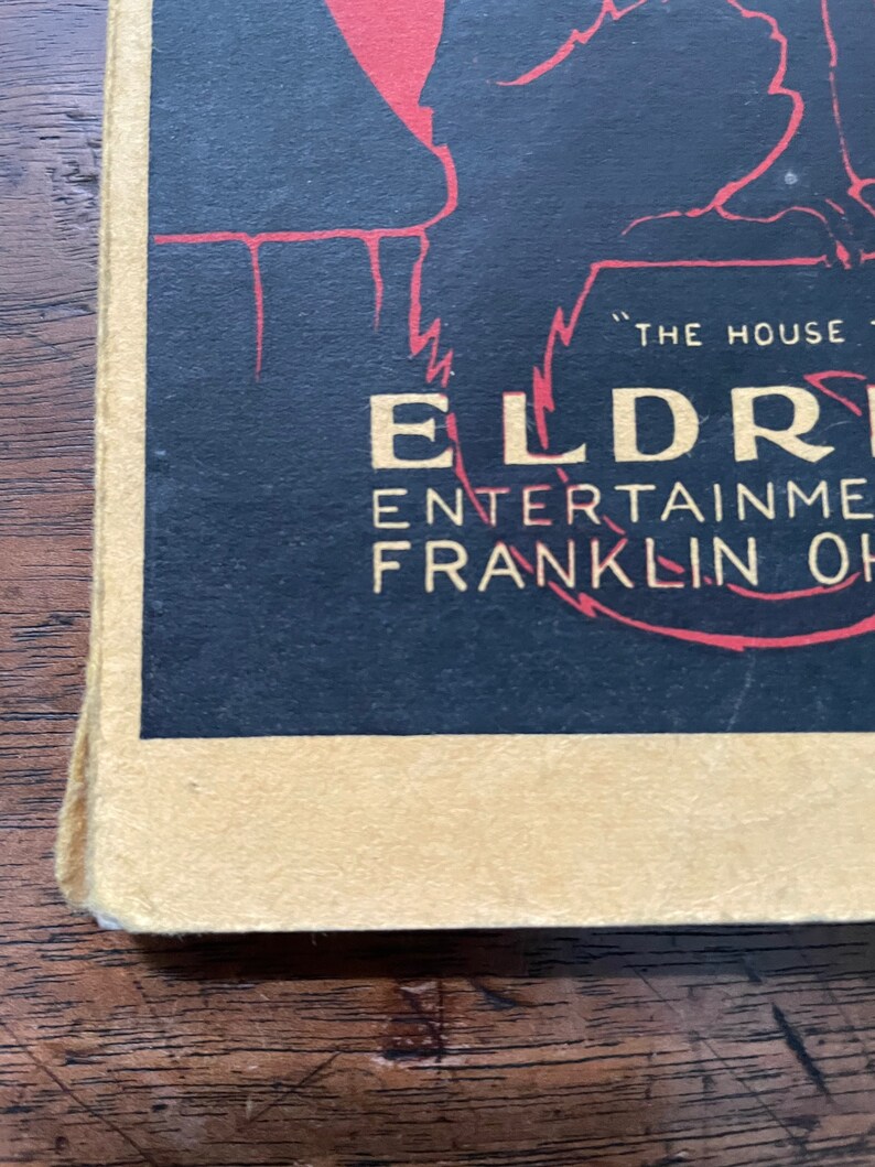 May include: A black and red vintage poster advertising "The House of Entertainment" at Eldredge Theatre in Franklin, Ohio.