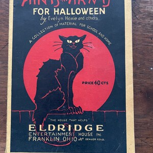 May include: A vintage book cover with a black cat silhouette against a red circle. The title is "Hints and Ha'nts for Halloween" by Evelyn Hoxie and others. The book is a collection of material for school and home. The price is 40 cents. The publisher is Eldridge Entertainment House Inc. in Franklin, Ohio and Denver, Colorado.