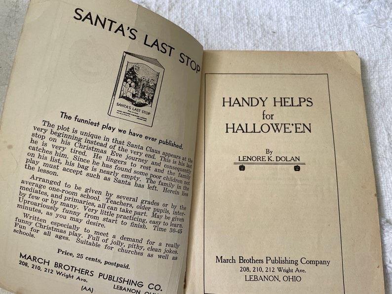 May include: A vintage book cover with the title "Santa's Last Stop" and a black and white illustration of Santa Claus with children. The book is published by March Brothers Publishing Company in Lebanon, Ohio. The back cover features the title "Handy Helps for Hallowe'en" by Lenore K. Dolan.