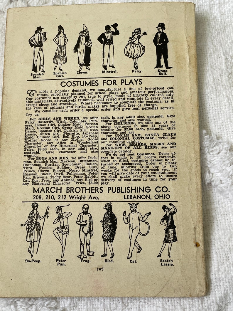 May include: A vintage advertisement for costumes for plays. The ad features illustrations of various costumes, including a Spanish man, Spanish girl, clown, minstrel, fairy, dress suit, so-peep, Peter Pan, frog, bird, cat, and Scotch Lassie. The ad also includes the company name, March Brothers Publishing Co., and their address in Lebanon, Ohio.