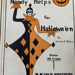 May include: A black and orange illustration of a jester holding stars. The jester is wearing a black mask and a black and orange diamond patterned costume. The text "Handy Helps For Hallowe'en" is written above the jester. The text "By Lenore K. Dolan" is written below the jester. The text "Price 40 Cents" is written below the text "By Lenore K. Dolan". The text "MARCH BROTHERS PUBLISHING CO. 208, 210, 212 WRIGHT AVENUE Lebanon, Ohio" is written below the text "Price 40 Cents".