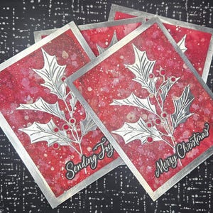 Juego de 4 tarjetas navideñas con acebo rojo y plateado