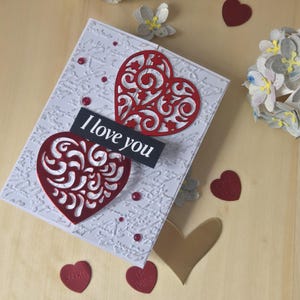 Valentijnskaart met 2 hartjes: ik hou van jou
