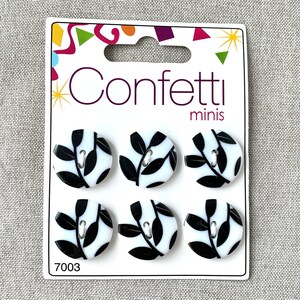 May include: Six black and white leaf design buttons on a white card with the text "Confetti minis" and "7003".