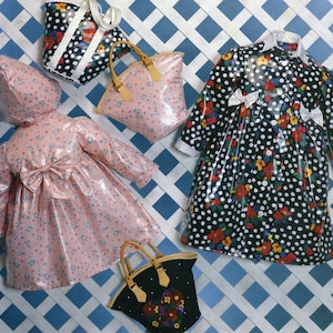 May include: A collection of glossy raincoats and handbags featuring a pink coat with a back bow, a black coat with white polka dots and floral patterns, and three handbags in matching pink and black floral and polka dot prints.