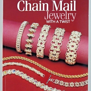 May include: A book titled Classic Chain Mail Jewelry WITH A TWIST by Sue Ripsch. The cover features five silver chain mail bracelets arranged horizontally and three additional chain necklaces displayed below on a deep red background.
