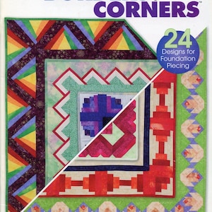 May include: A quilting instructional book titled Log Cabin Borders and Corners featuring 24 Designs for Foundation Piecing by Linda Causee. The cover displays a split-view quilt pattern with geometric shapes in red, green, purple, and yellow.