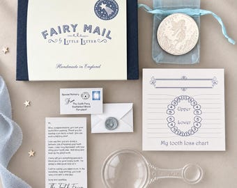 May include: A Fairy Mail kit by Little Letter includes a dark blue box, a silver fairy coin in a light blue organza bag, a tooth loss chart, a magnifying glass, a small envelope with a wax seal, and a letter from the Tooth Fairy.