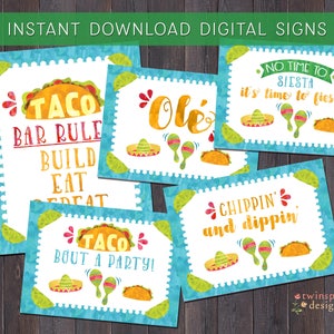 May include: Set of eight printable digital signs for a fiesta themed party. The signs feature a blue and green watercolor background with illustrations of tacos, maracas, and sombreros. The text on the signs includes "Taco Bar Rule", "Build Eat Repeat", "Taco Bout a Party", "Ole", "No Time to Siesta, It's Time to Fiesta", and "Chippin' and Dippin'."